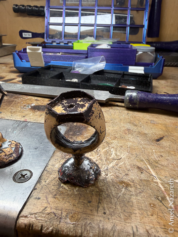 The ring is cast, with sprue still attached